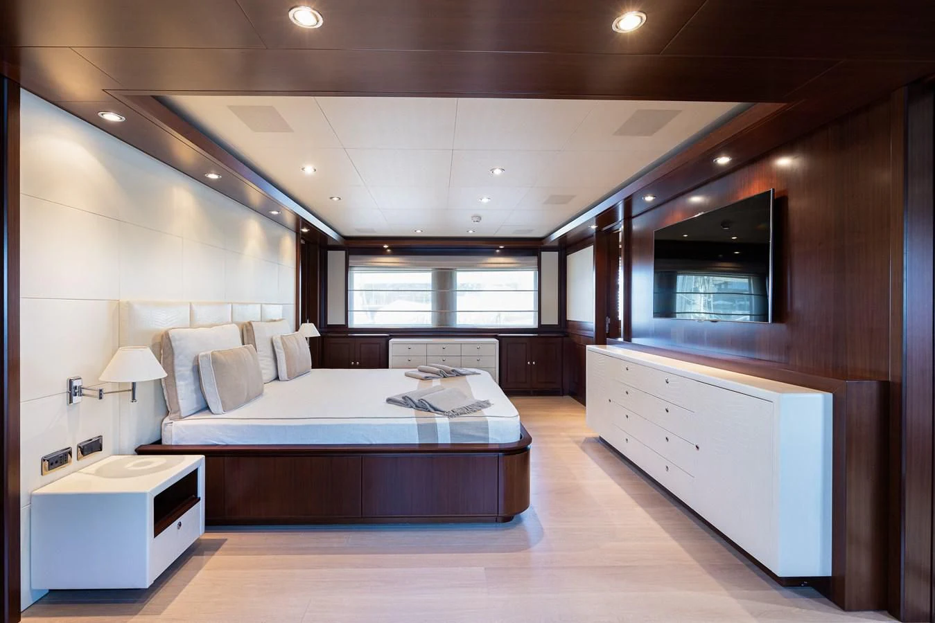 a large bedroom with a bed aboard PALATIAL Yacht for Sale