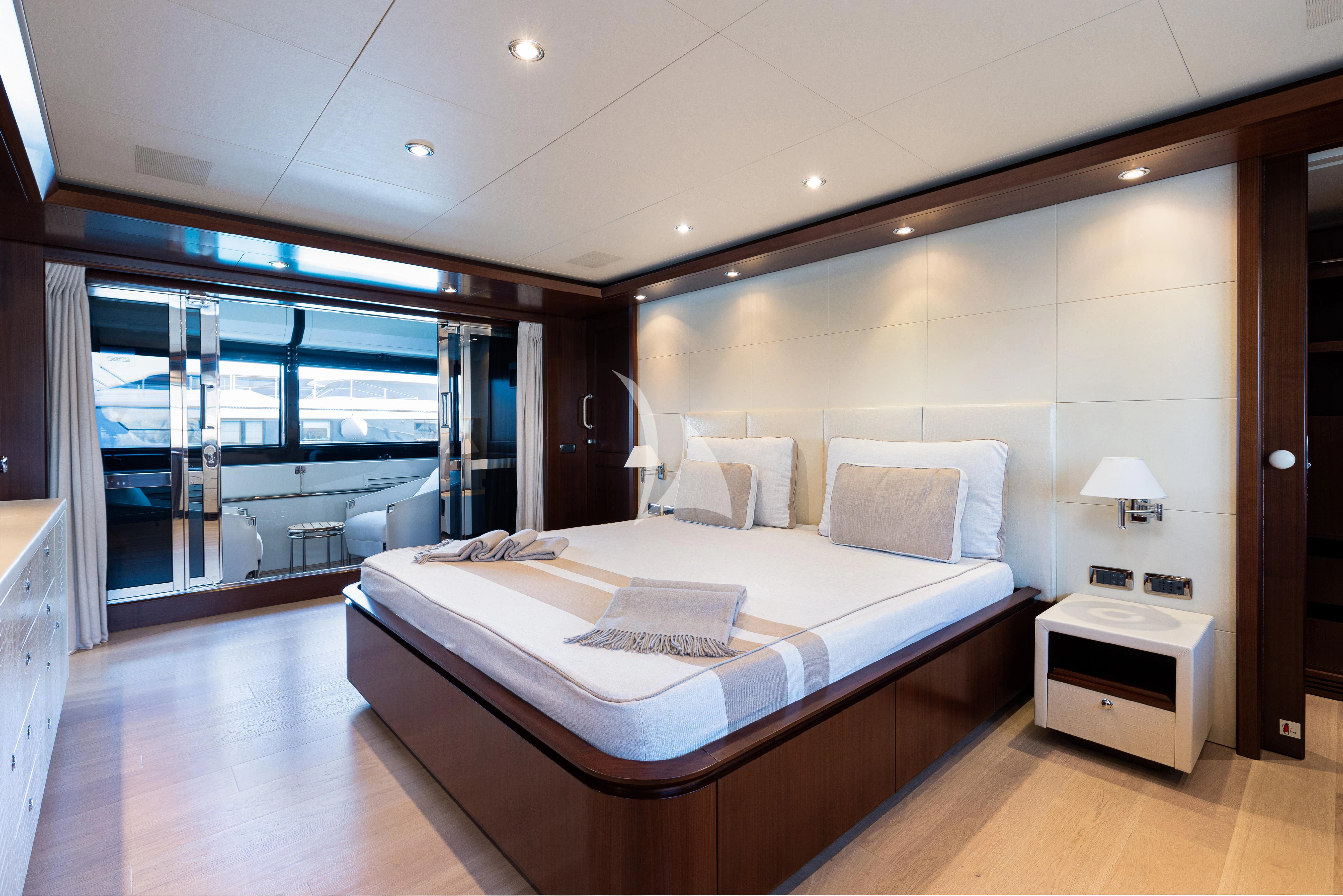 a hotel room with a bed aboard PALATIAL Yacht for Sale