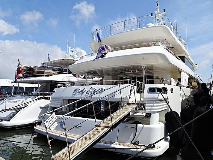 a large white boat docked aboard PALATIAL Yacht for Sale