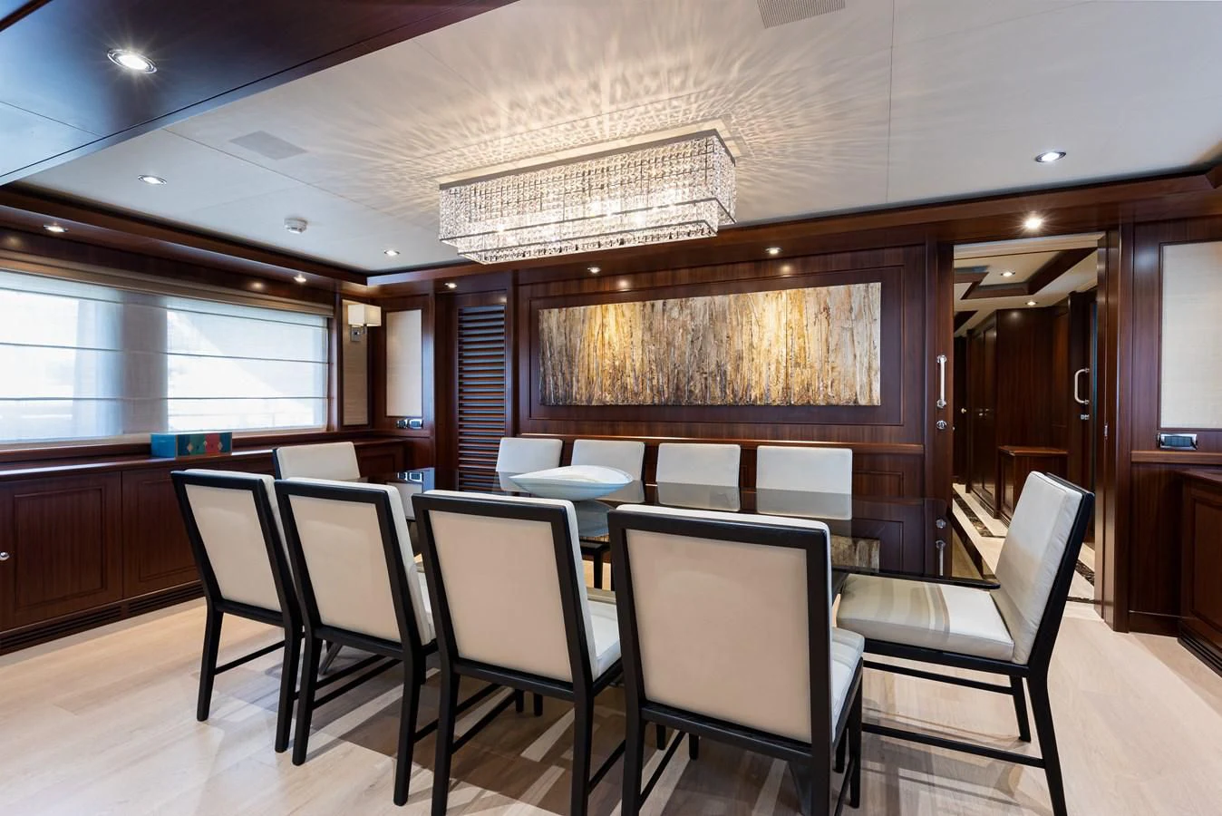 a room with a table chairs and a large window aboard PALATIAL Yacht for Sale