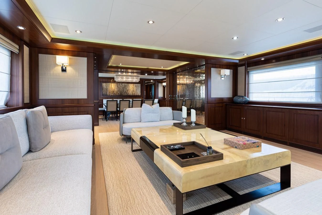 a living room with a couch and a coffee table aboard PALATIAL Yacht for Sale
