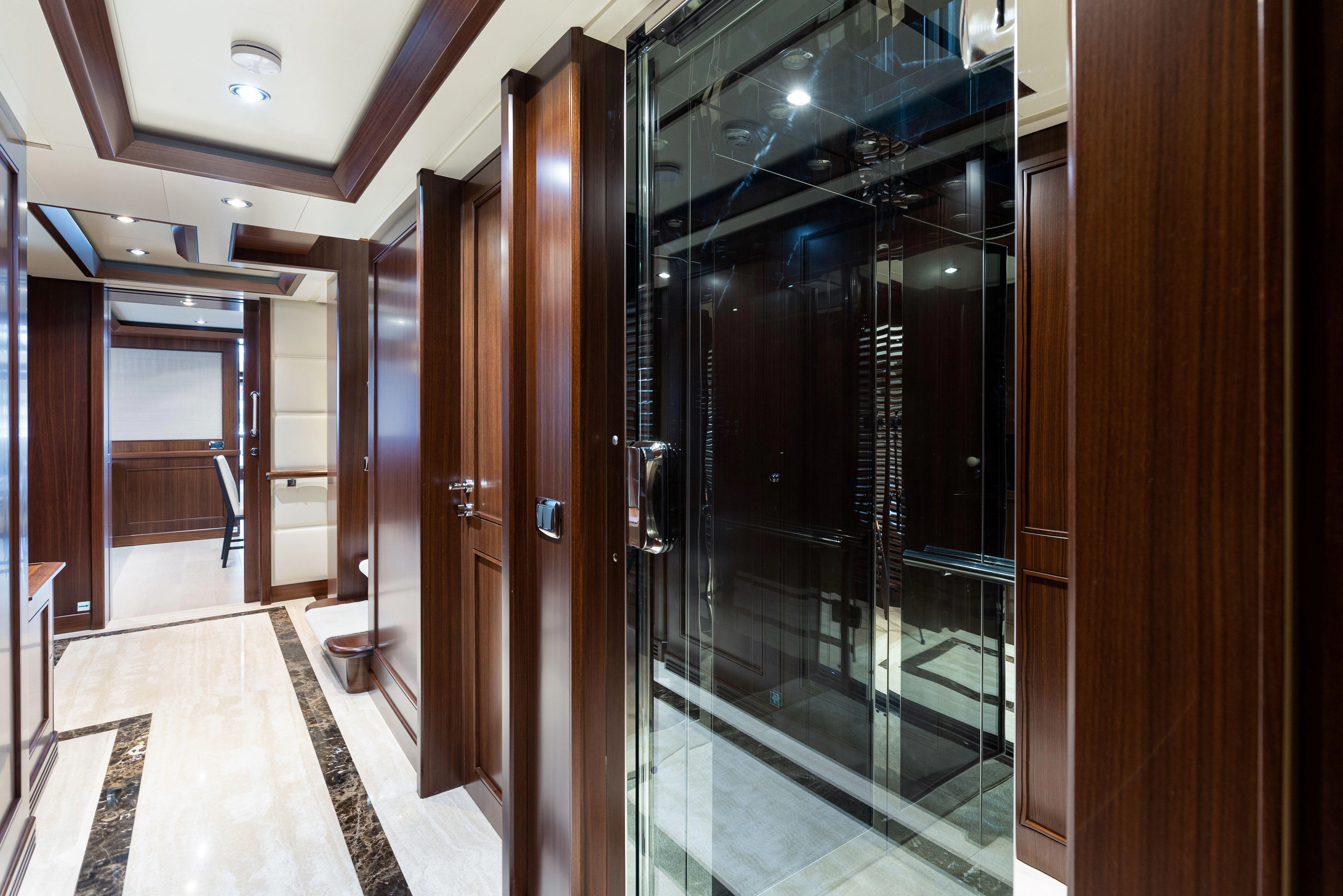 a hallway with doors aboard PALATIAL Yacht for Sale