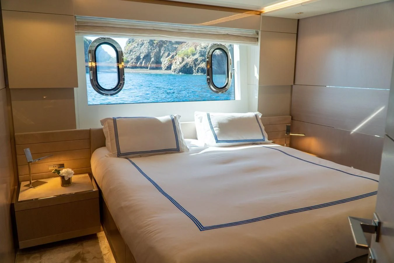 a bed with a blue sheet aboard SHELLS X Yacht for Sale