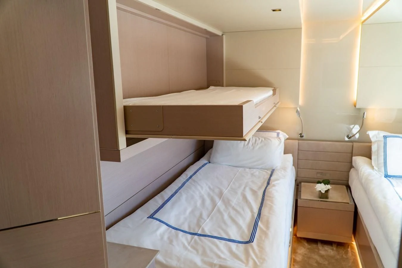 a room with a bed and a shelf with a white pillow aboard SHELLS X Yacht for Sale