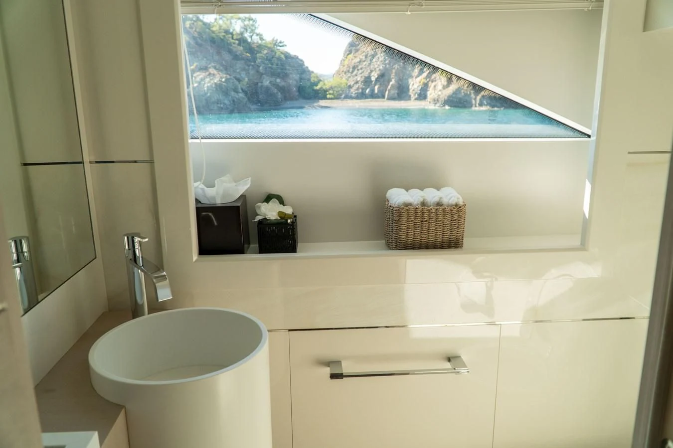 a bathroom with a large window aboard SHELLS X Yacht for Sale
