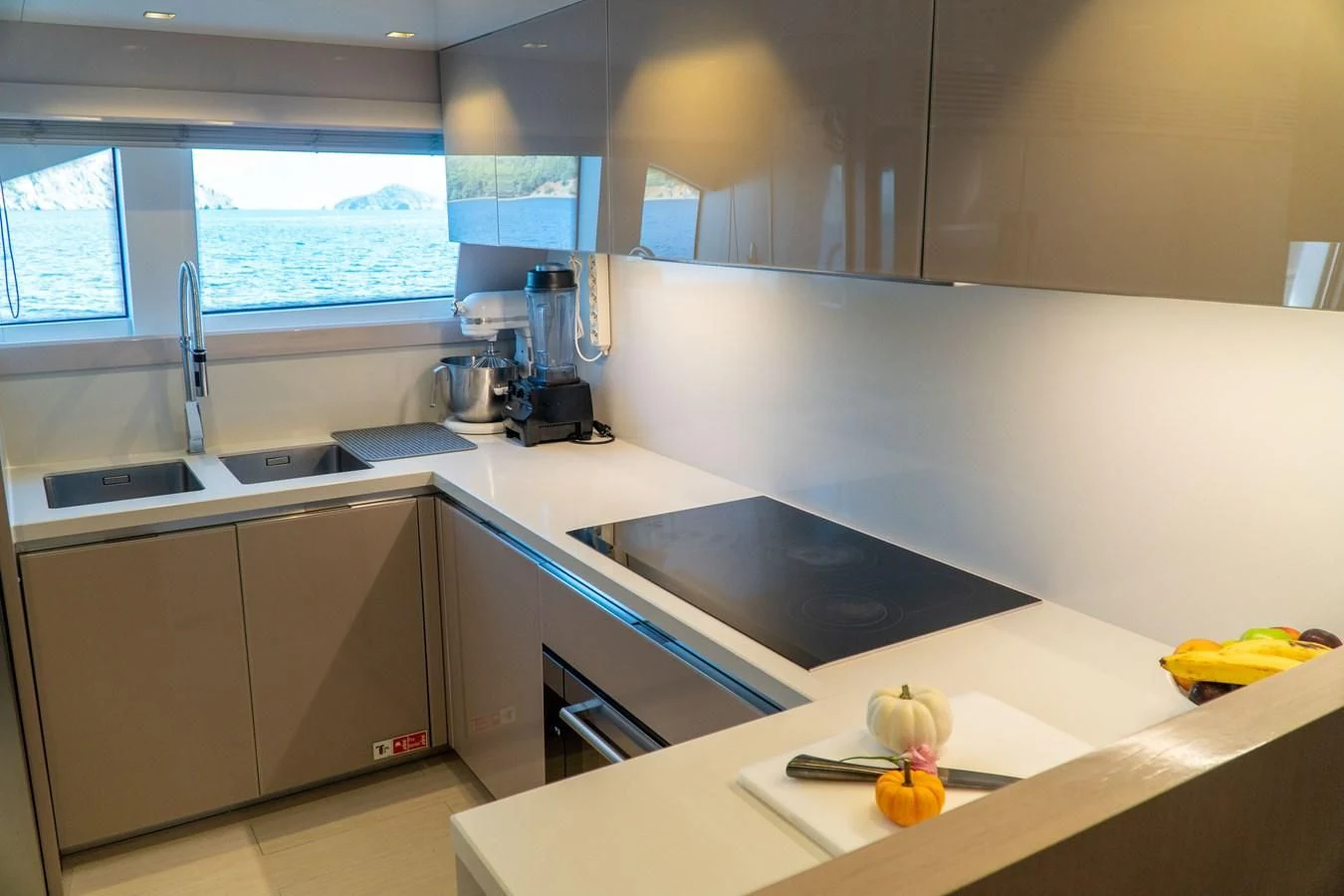 a kitchen with a sink and a window aboard SHELLS X Yacht for Sale