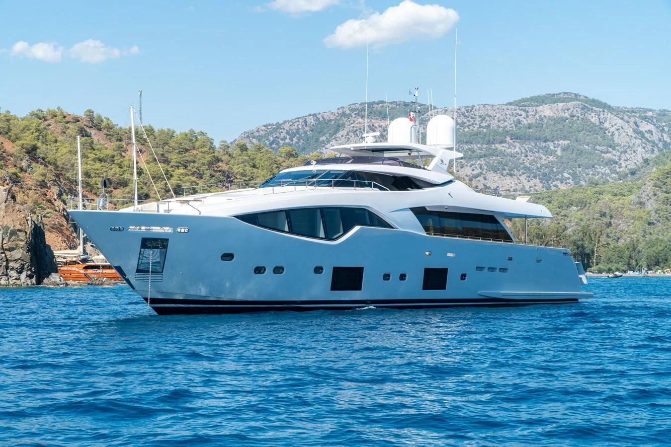 a white yacht on the water aboard SHELLS X Yacht for Sale