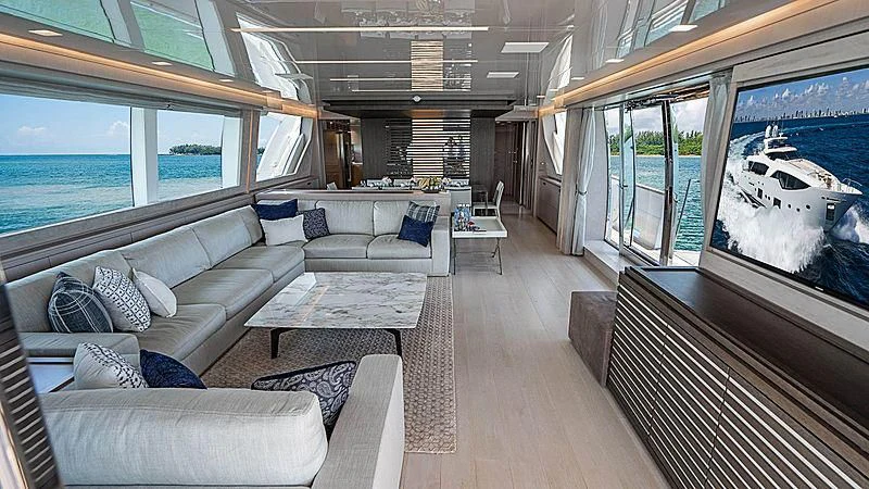 a room with a couch and a tv aboard SHELLS X Yacht for Sale