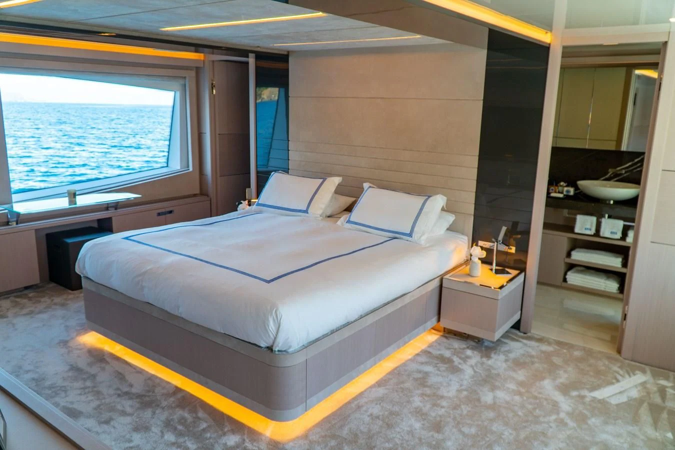 a bedroom with a large bed aboard SHELLS X Yacht for Sale