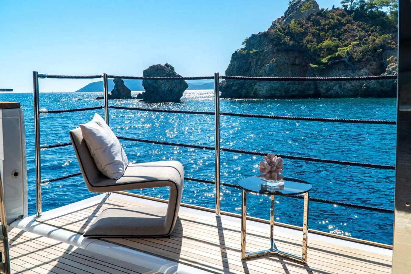 a cat sitting on a chair on a boat aboard SHELLS X Yacht for Sale