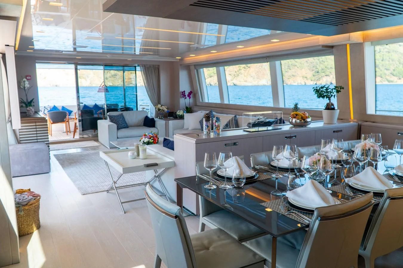 a large kitchen with a large dining table aboard SHELLS X Yacht for Sale