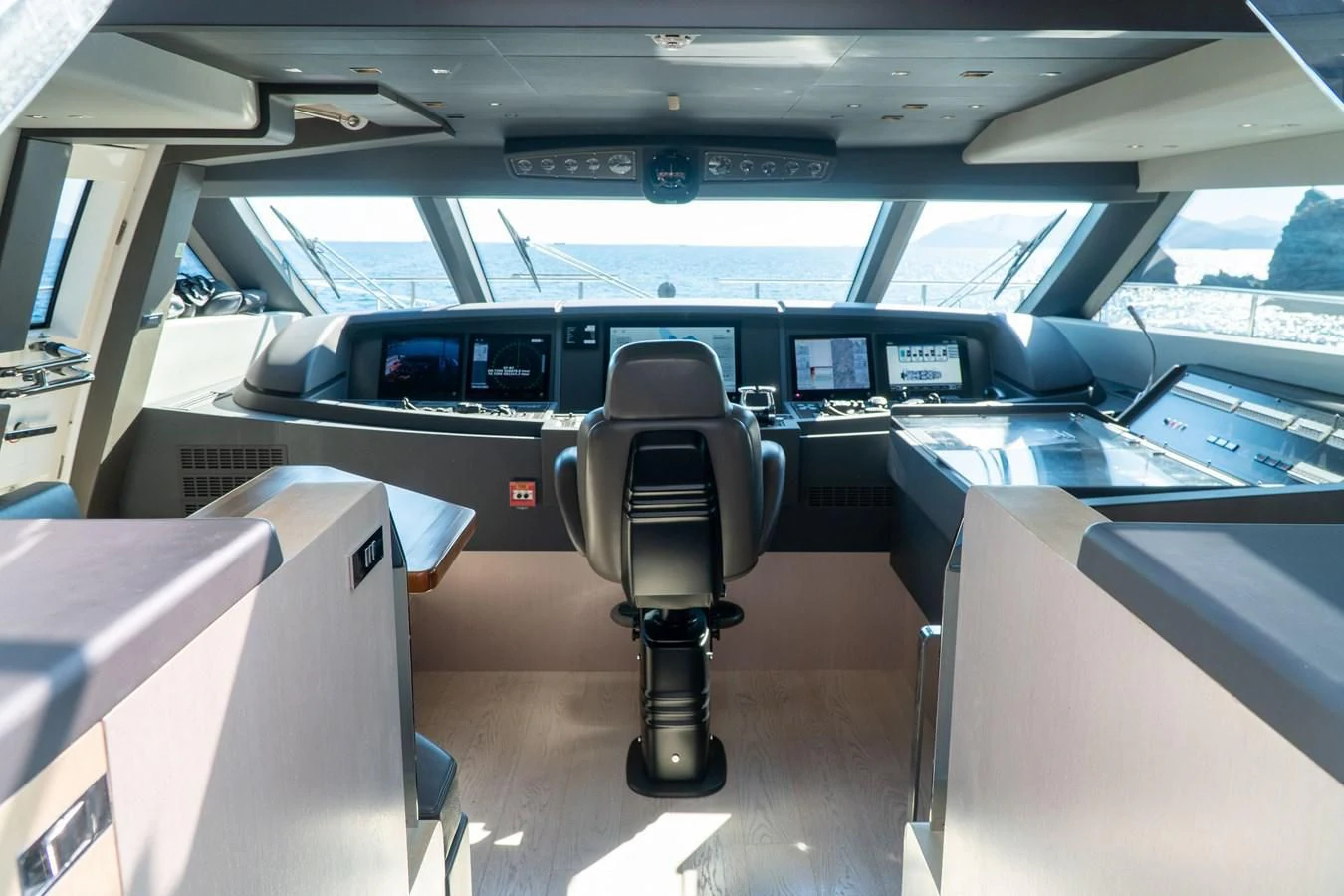 a black chair in a cockpit aboard SHELLS X Yacht for Sale