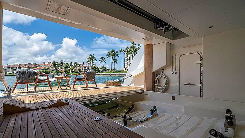 a room with a table and chairs aboard SHELLS X Yacht for Sale