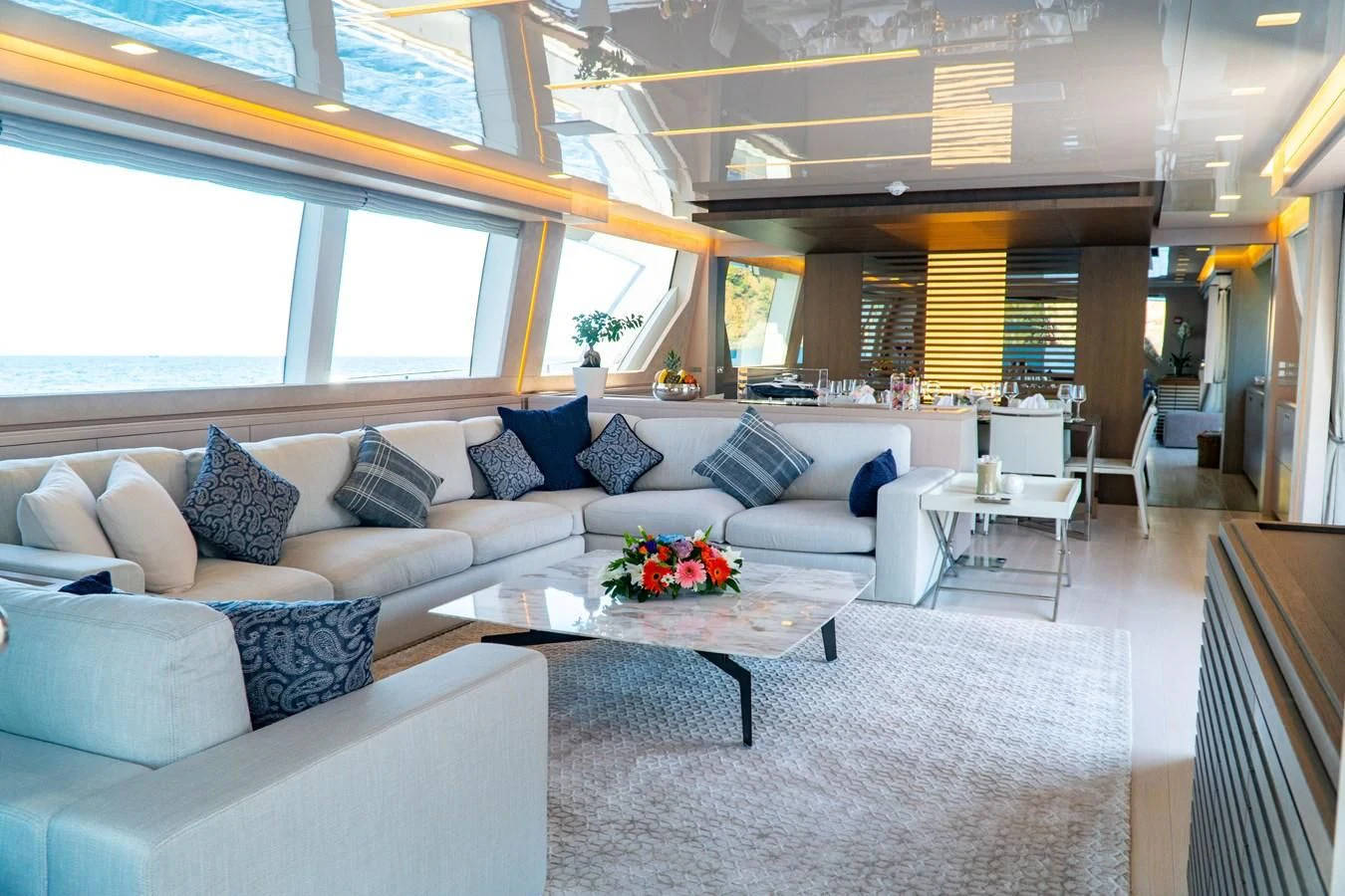 a large living room with a large window aboard SHELLS X Yacht for Sale