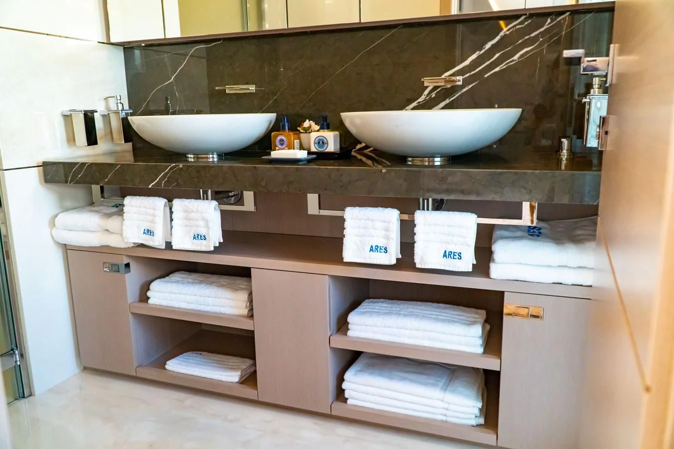 a counter with a sink and a couple of bowls on it aboard SHELLS X Yacht for Sale