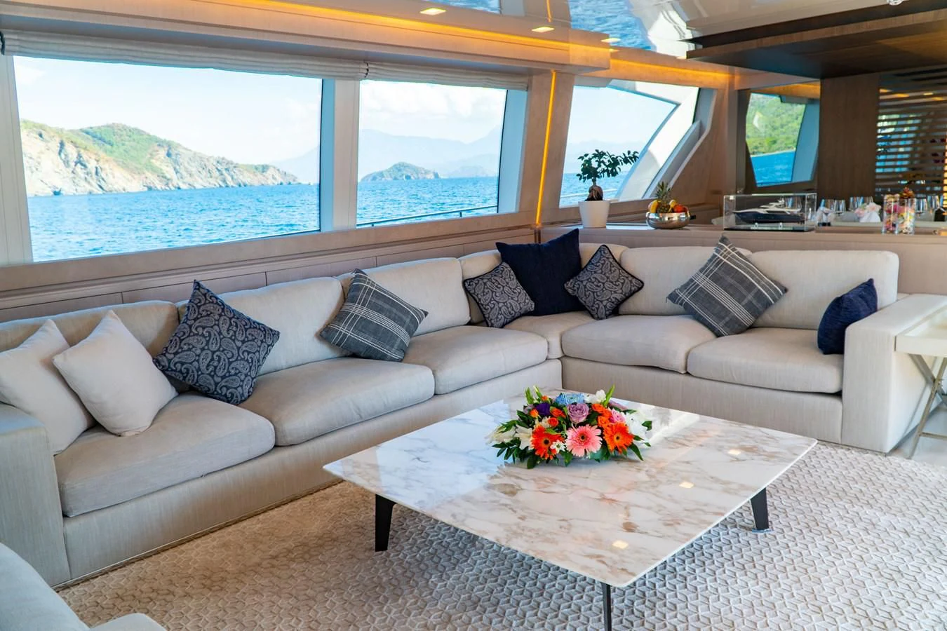 a living room with a large window aboard SHELLS X Yacht for Sale