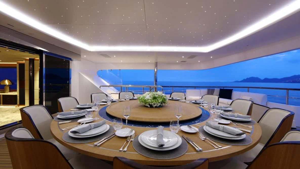 a large dining room with a large table set for a meal aboard FORMOSA Yacht for Sale