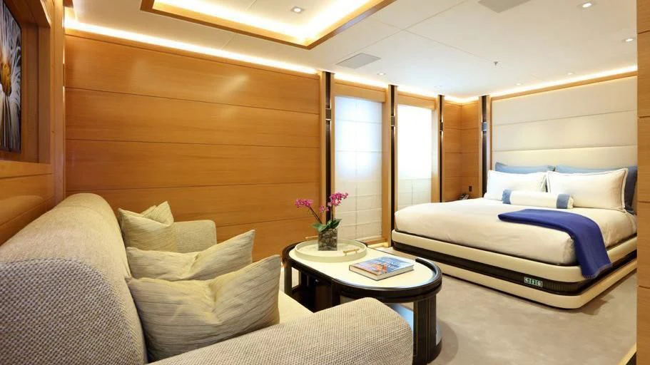 a room with a bed and a table aboard FORMOSA Yacht for Sale