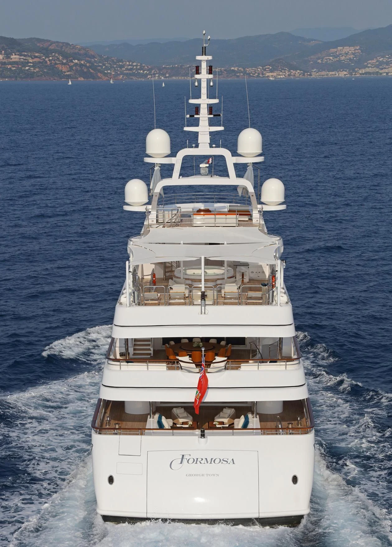 a white boat on the water aboard FORMOSA Yacht for Sale