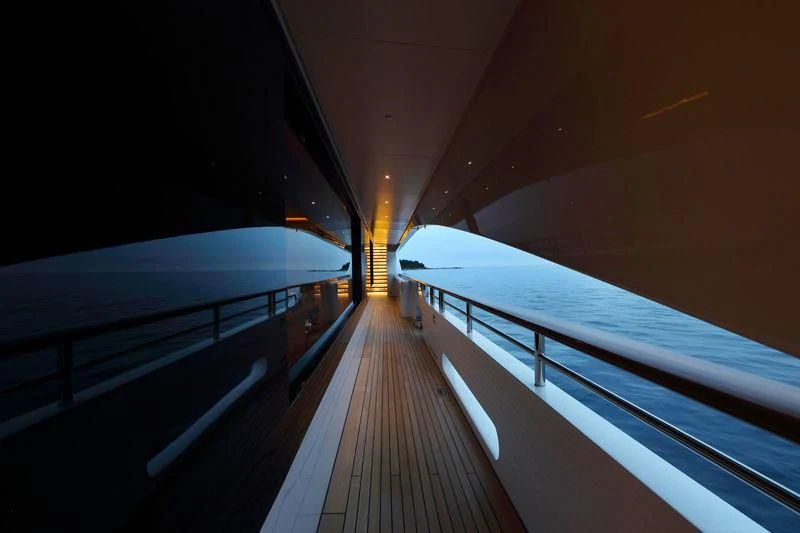a wooden walkway with a white umbrella aboard FORMOSA Yacht for Sale
