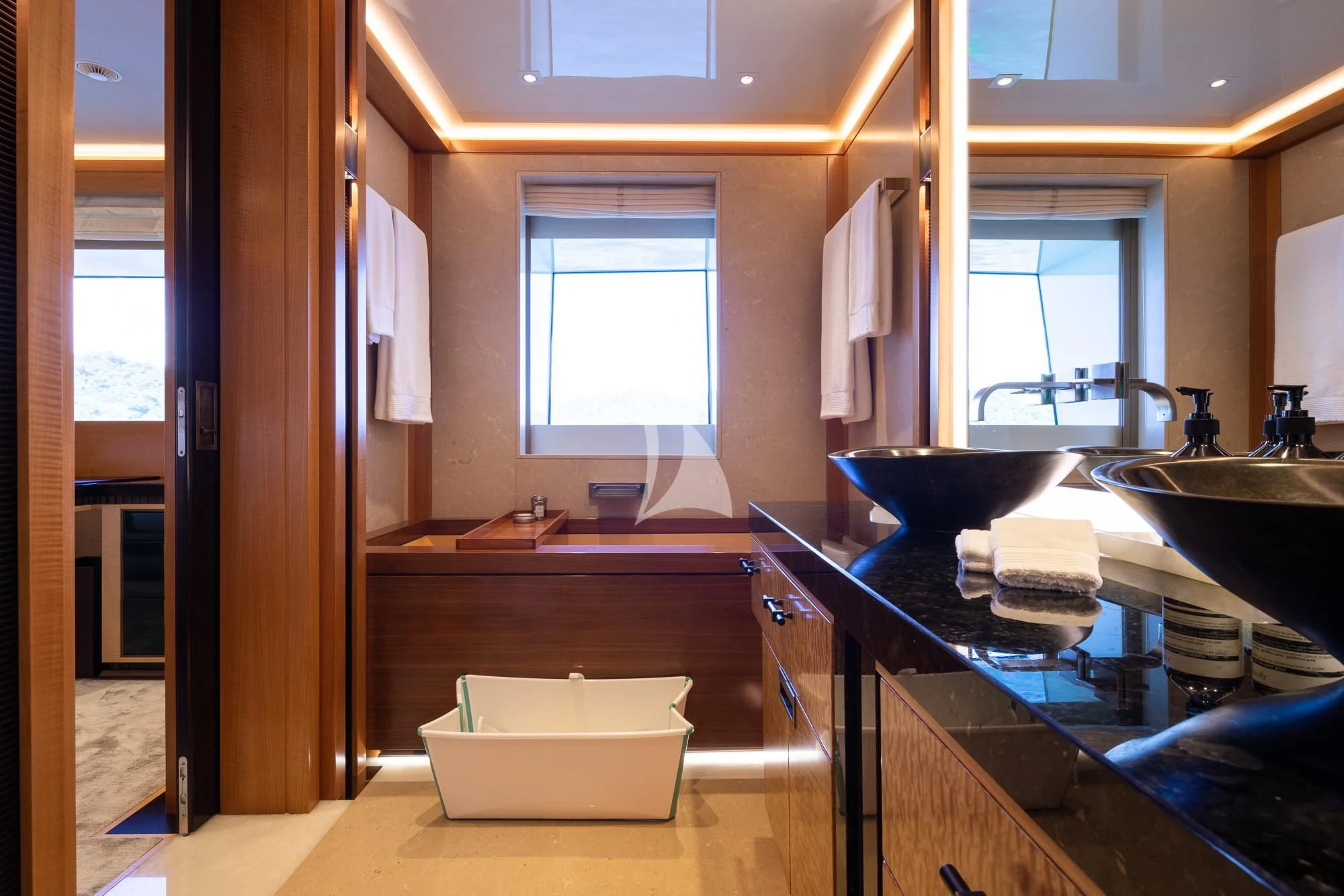 a bathroom with a sink and a bathtub aboard FORMOSA Yacht for Sale