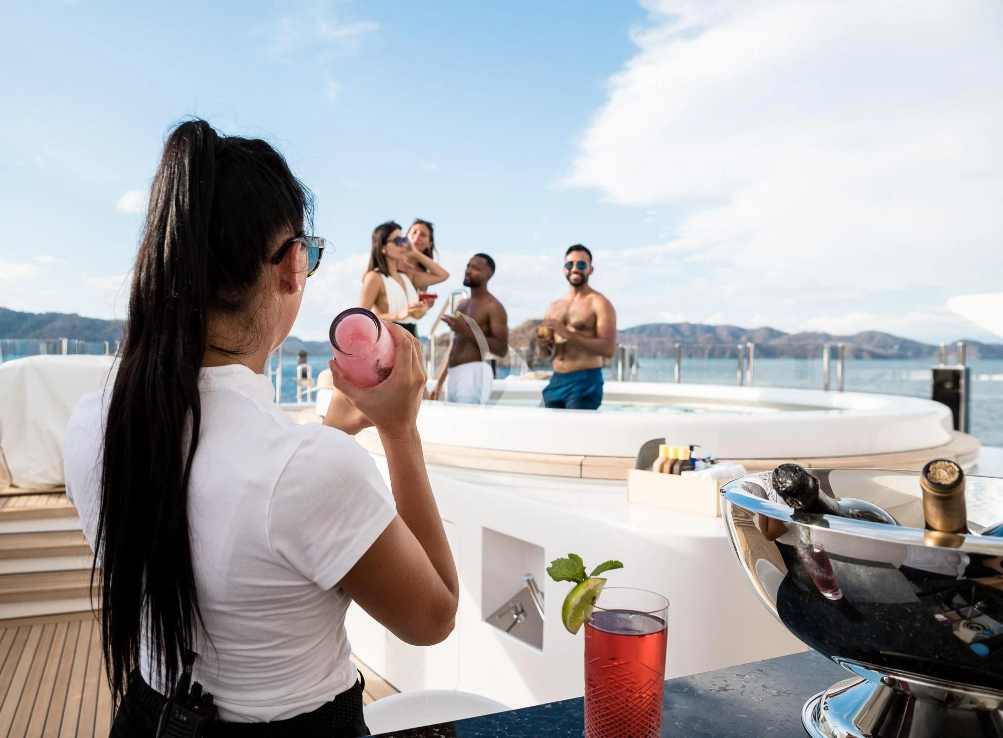 a woman holding a pink object aboard FORMOSA Yacht for Sale