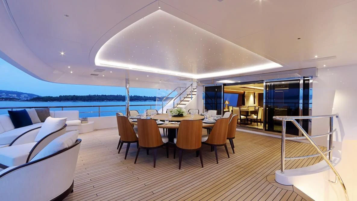 a room with a table and chairs aboard FORMOSA Yacht for Sale