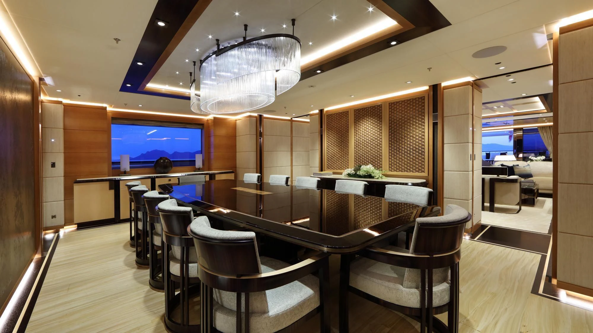 a room with a table chairs and a large window aboard FORMOSA Yacht for Sale
