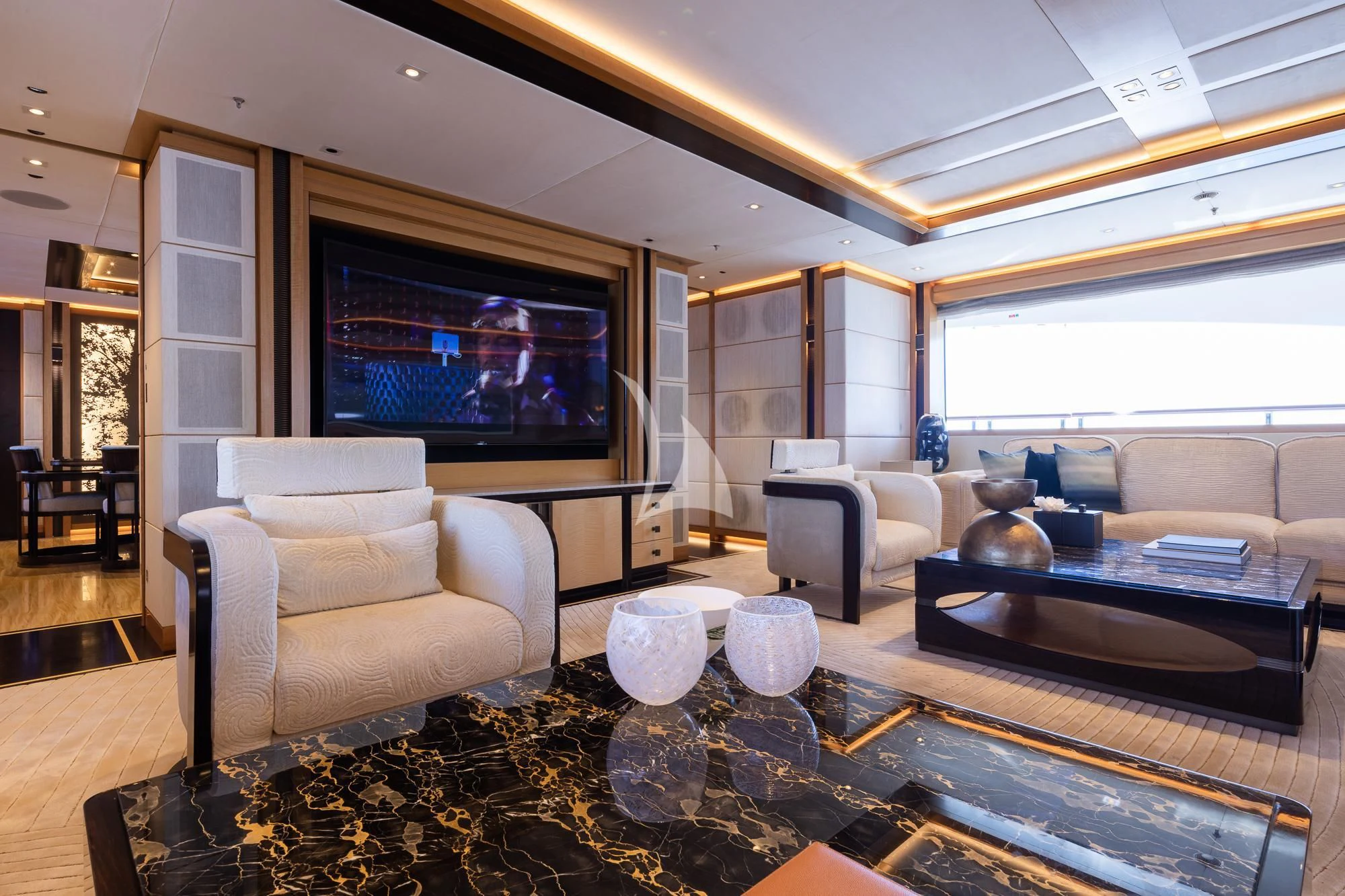 a living room with a large screen aboard FORMOSA Yacht for Sale