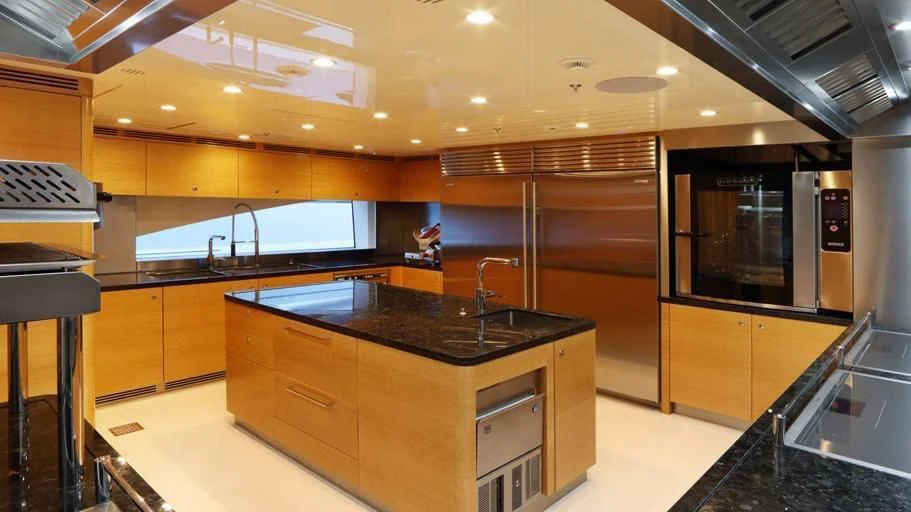 a kitchen with a large island aboard FORMOSA Yacht for Sale