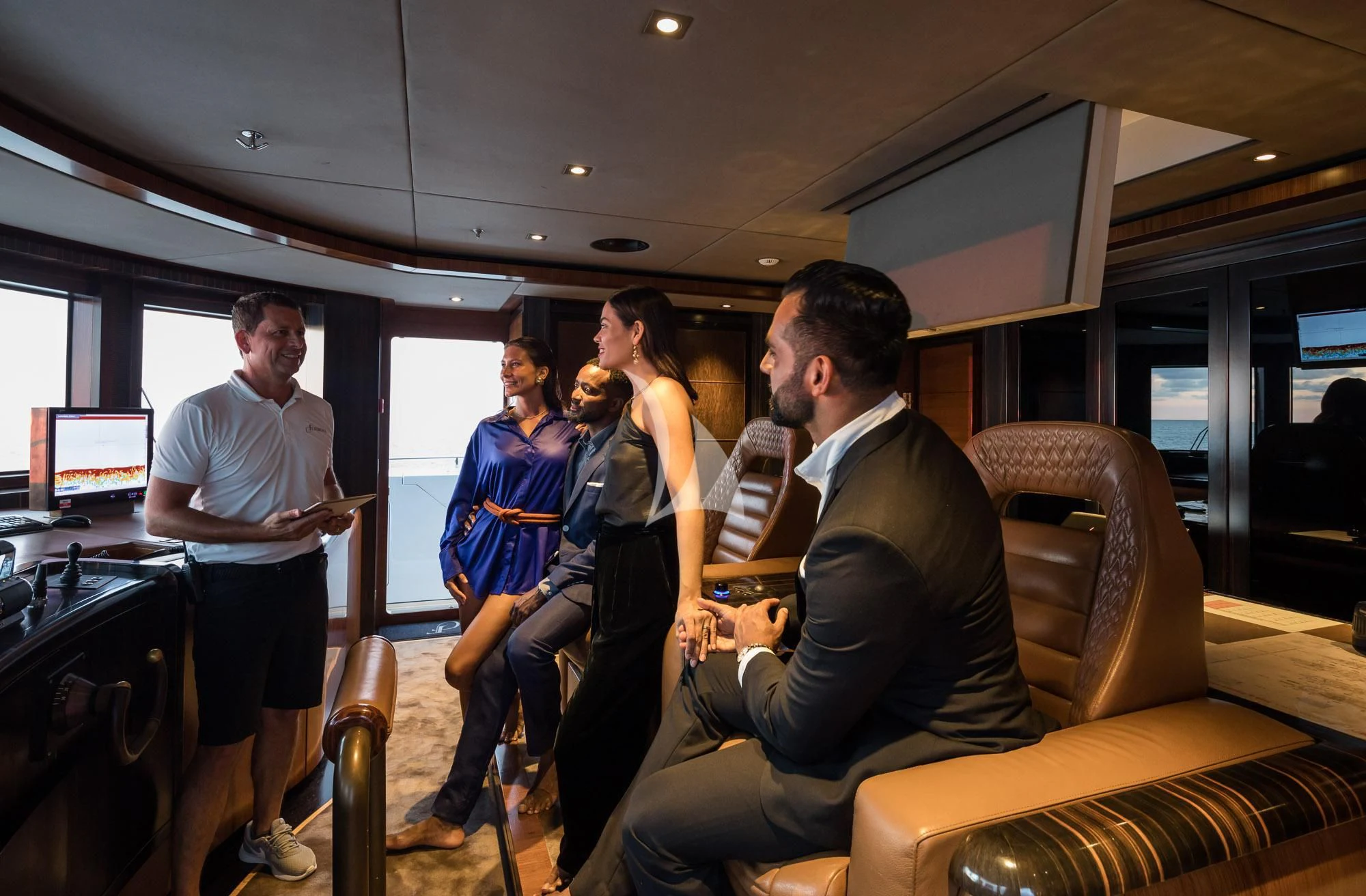 a group of people in a room aboard FORMOSA Yacht for Sale