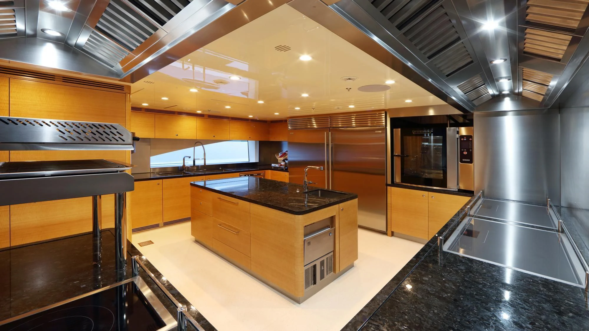 a large kitchen with a large island aboard FORMOSA Yacht for Sale