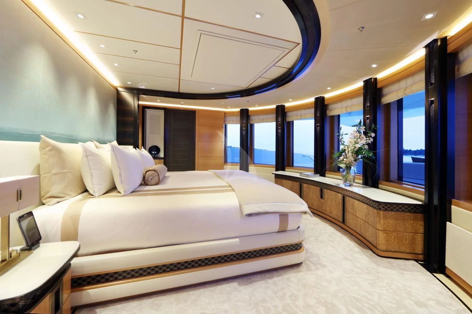 a room with a bed and a large mirror aboard FORMOSA Yacht for Sale