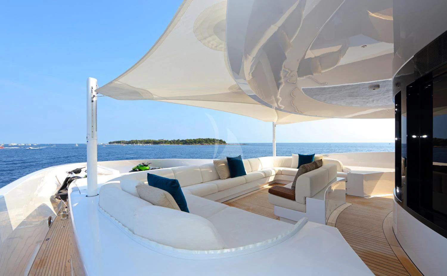 a room with a bed and a chair and a large white umbrella aboard FORMOSA Yacht for Sale