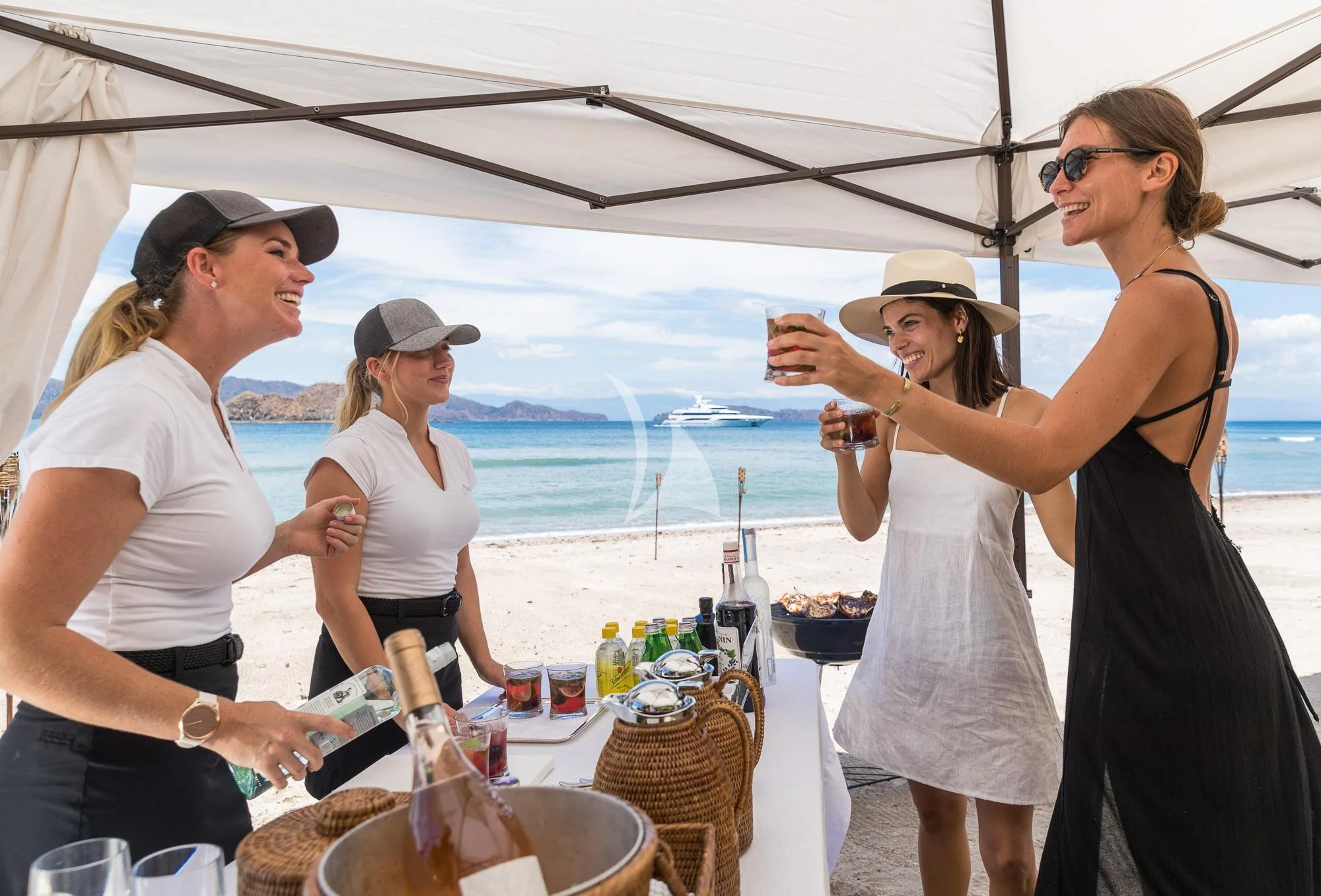 a group of people at a table aboard FORMOSA Yacht for Sale