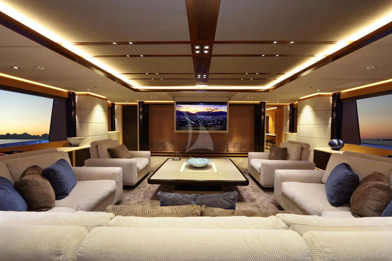 a room with a couch and a tv on the wall aboard FORMOSA Yacht for Sale