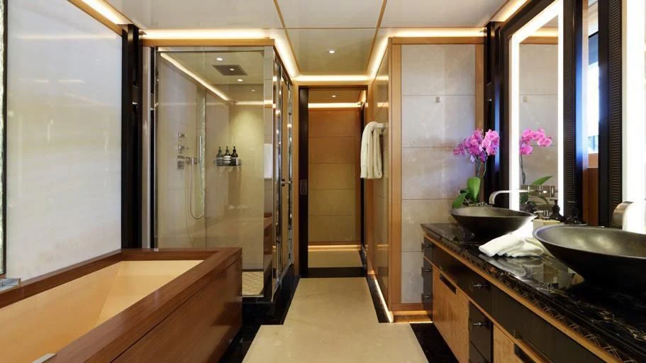 a bathroom with a sink and a large mirror aboard FORMOSA Yacht for Sale