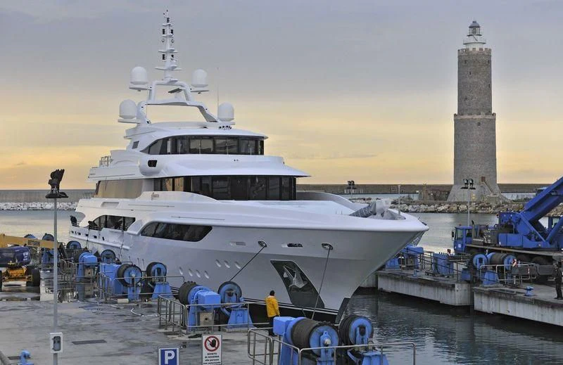 a large white boat docked at a pier aboard FORMOSA Yacht for Sale