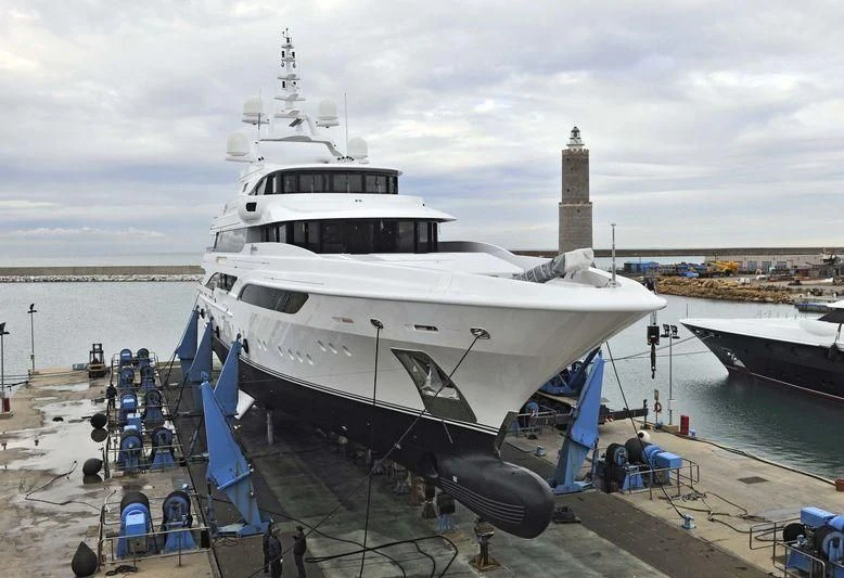 a large white ship docked aboard FORMOSA Yacht for Sale