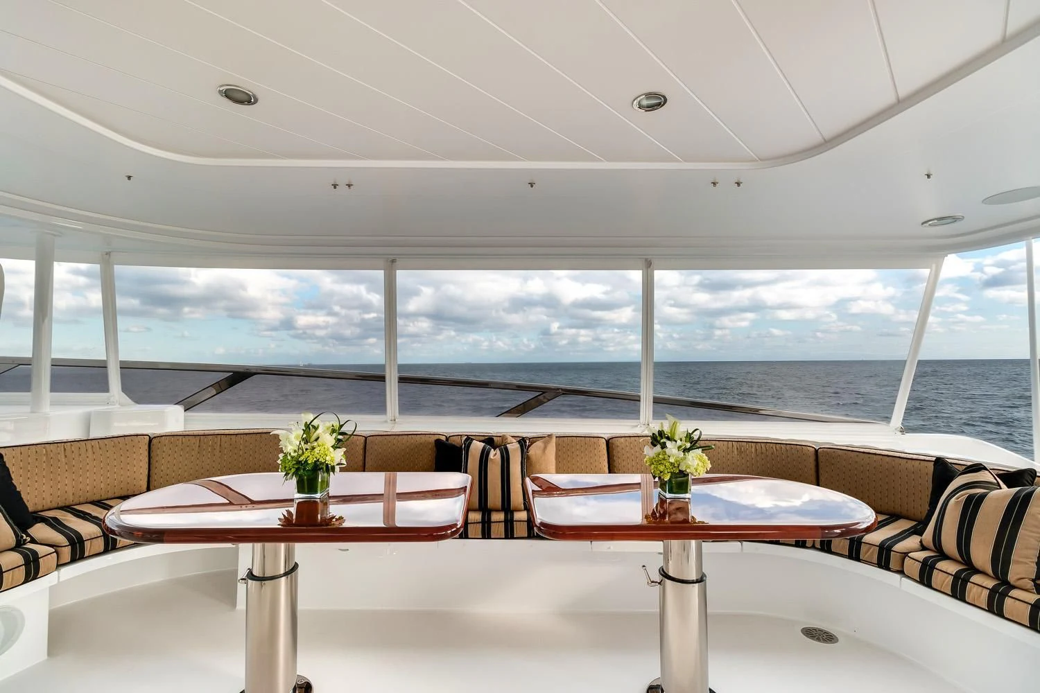 a room with a table and chairs aboard ESENSE Yacht for Sale
