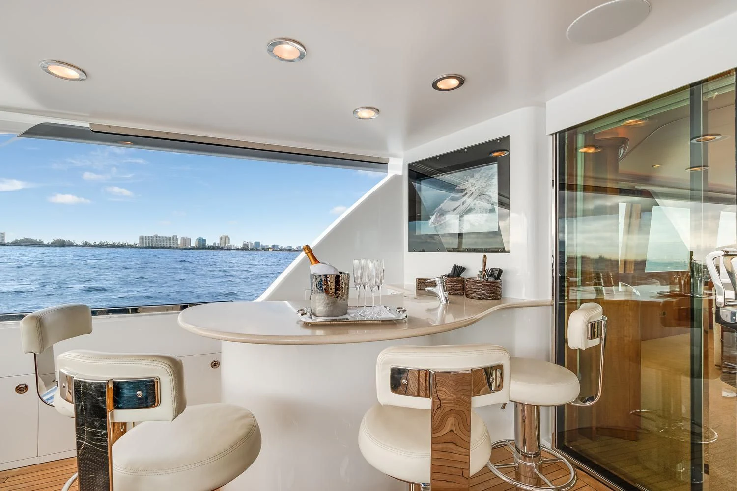 a room with a table and chairs aboard ESENSE Yacht for Sale