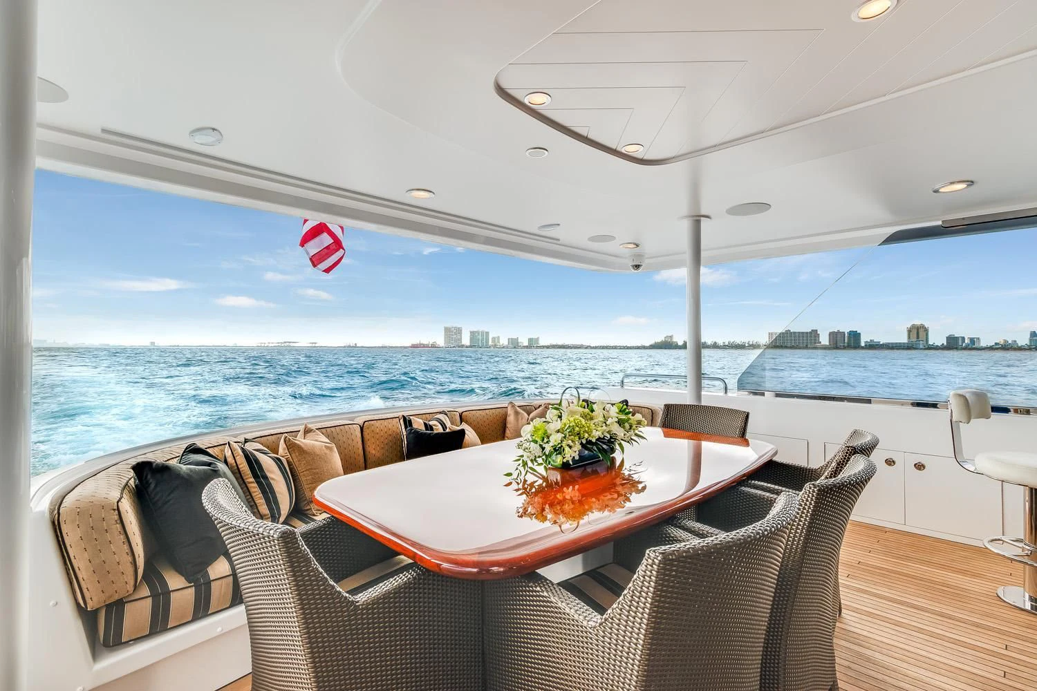 a table and chairs on a boat aboard ESENSE Yacht for Sale