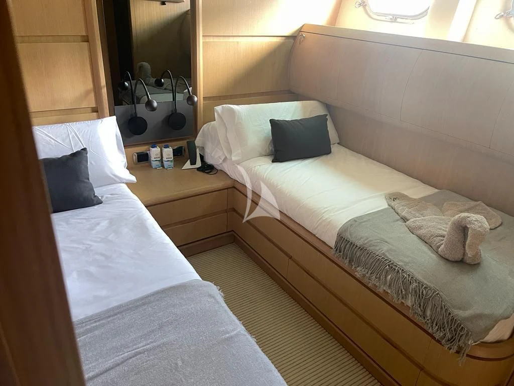 a couple of beds in a room aboard B4 Yacht for Charter
