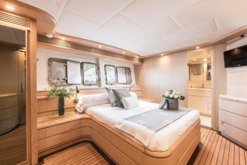 a bed in a room aboard B4 Yacht for Charter