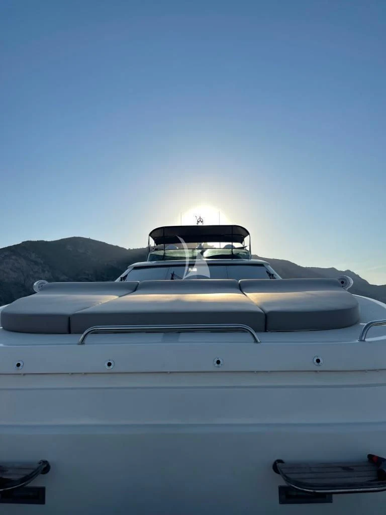 the front of a white car aboard B4 Yacht for Charter