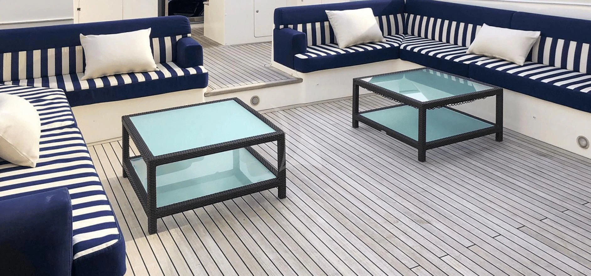 a room with a couch and a table aboard B4 Yacht for Charter