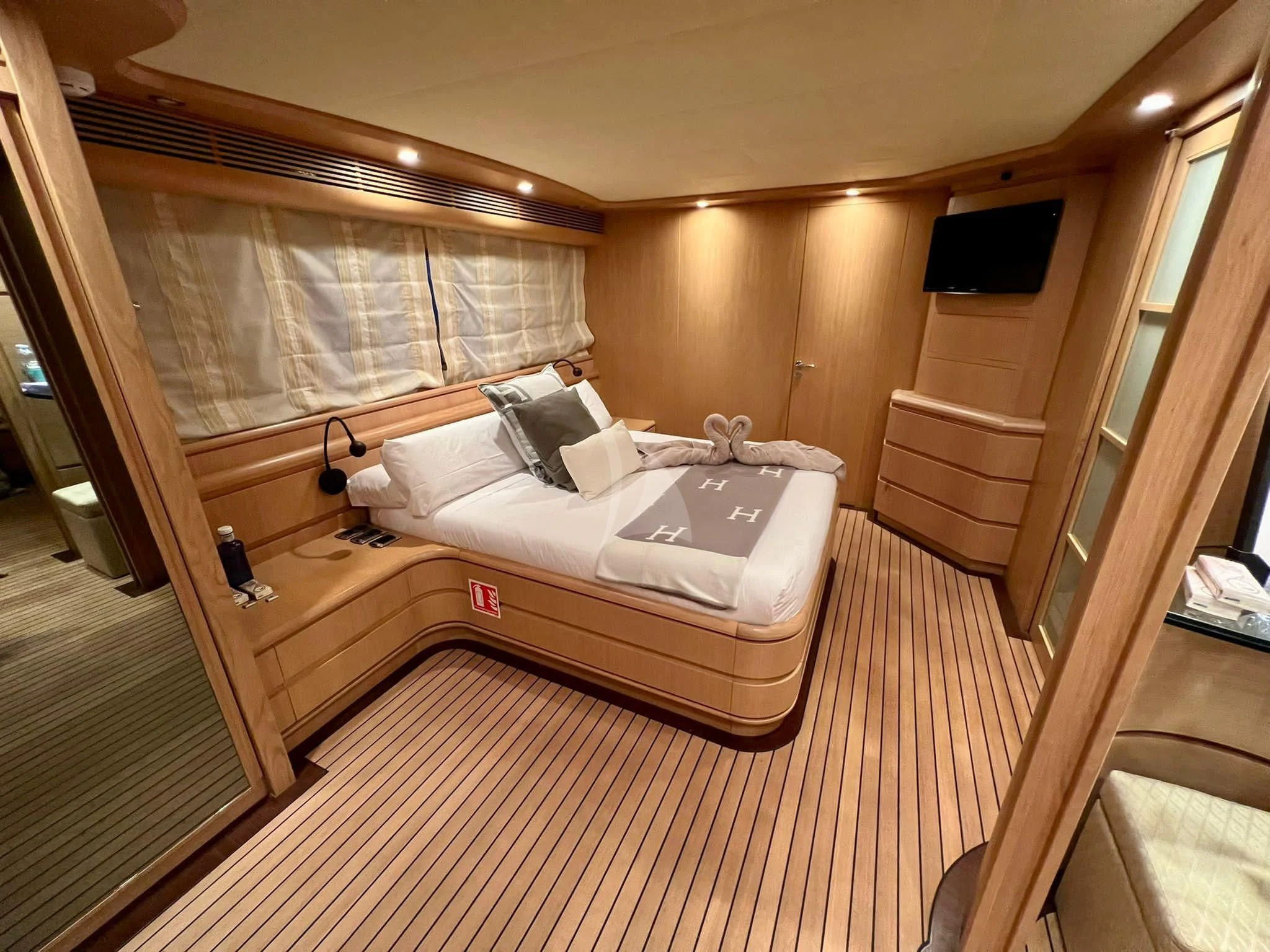 a bed in a room aboard B4 Yacht for Charter