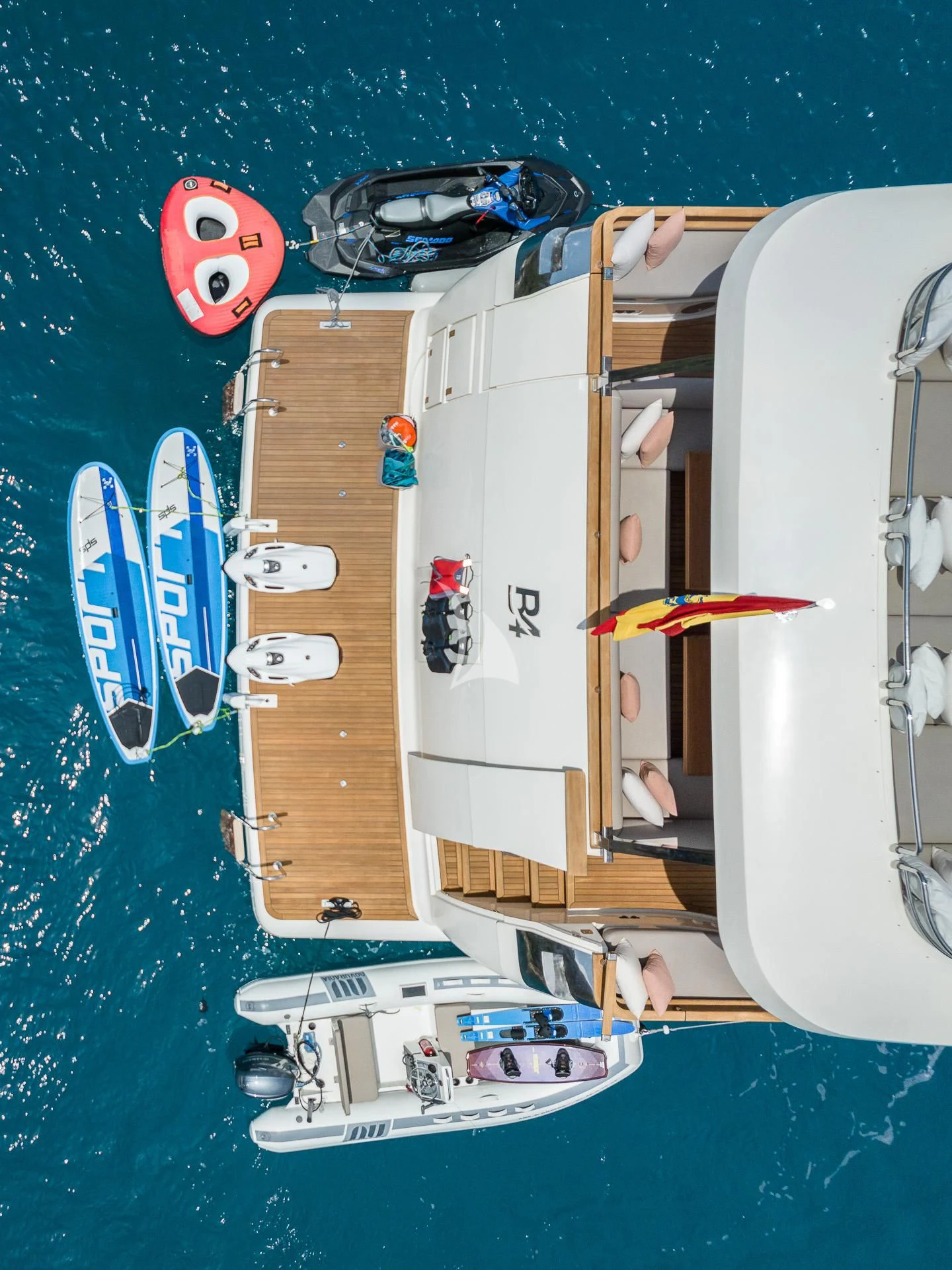 a boat with a paddle on the water aboard B4 Yacht for Charter