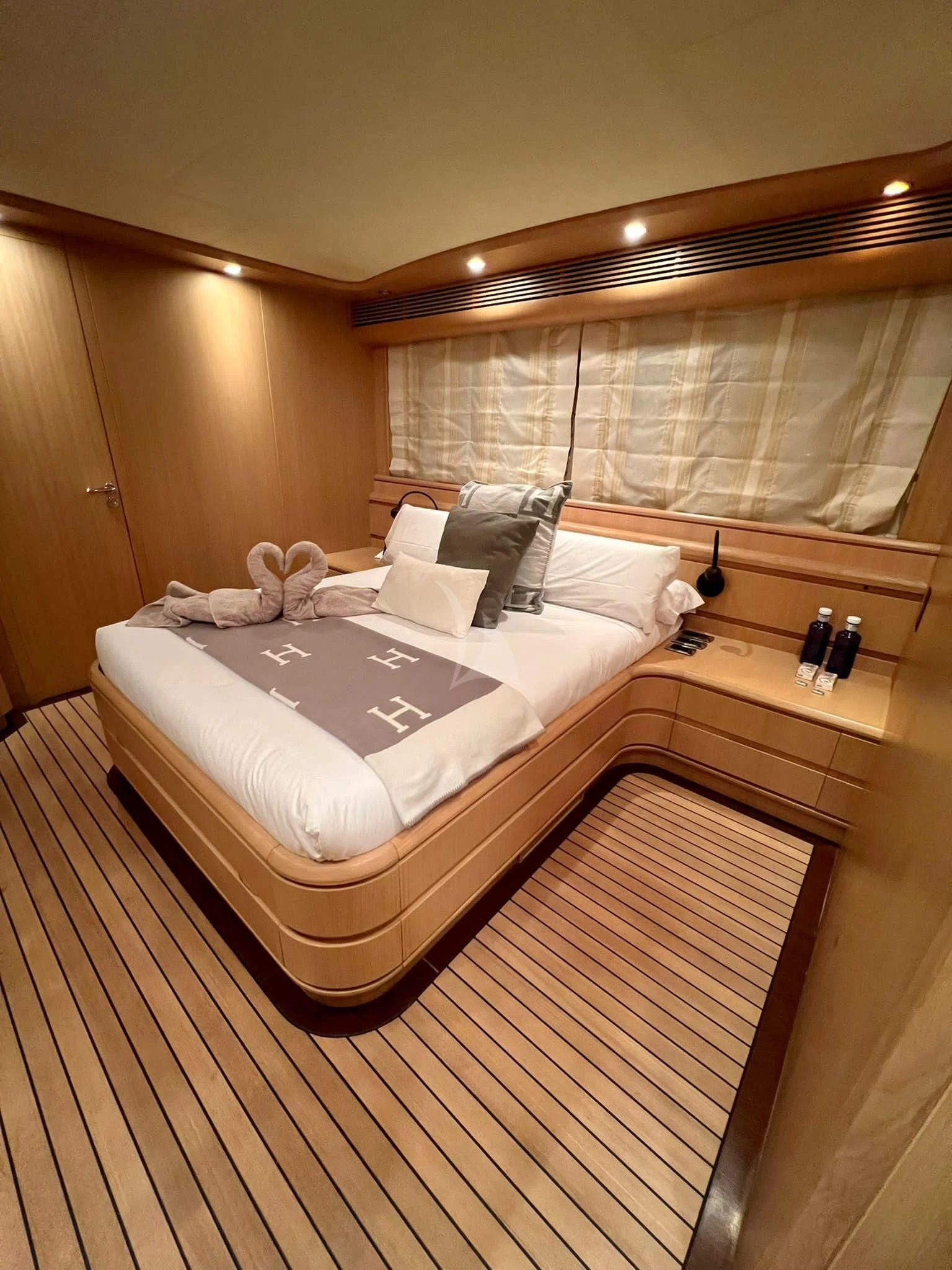 a bed in a room aboard B4 Yacht for Charter