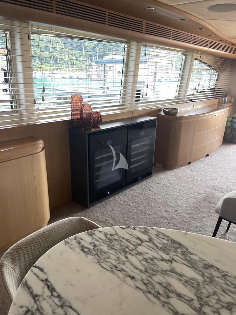 a living room with a fireplace aboard B4 Yacht for Charter